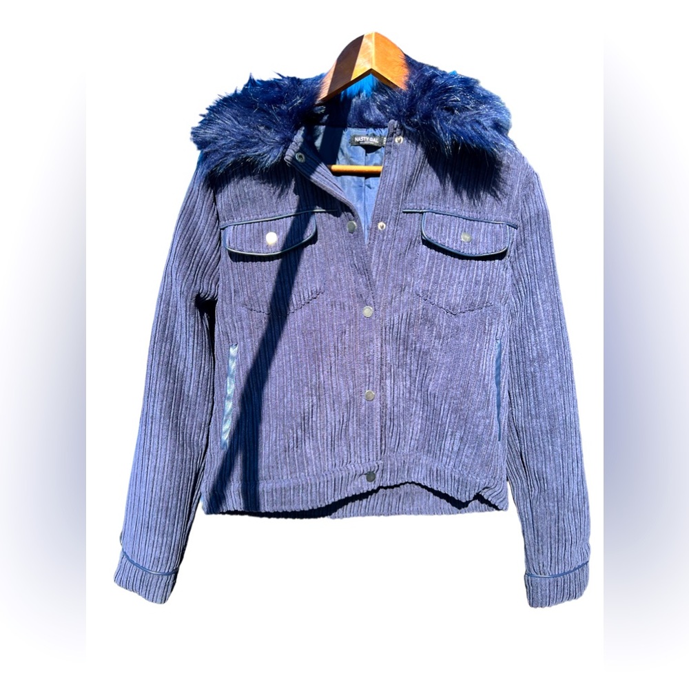 Corduroy Jacket with faux fur collar and faux leather trim.